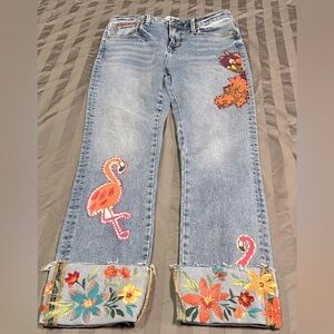 Up cycled jeans. Hand sewn and embroidered detail.